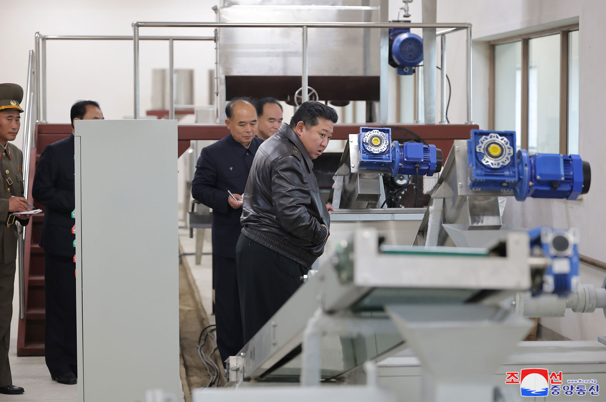 President of State Affairs Kim Jong Un gives field guidance at regional-industry factories under construction in Jaeryong County