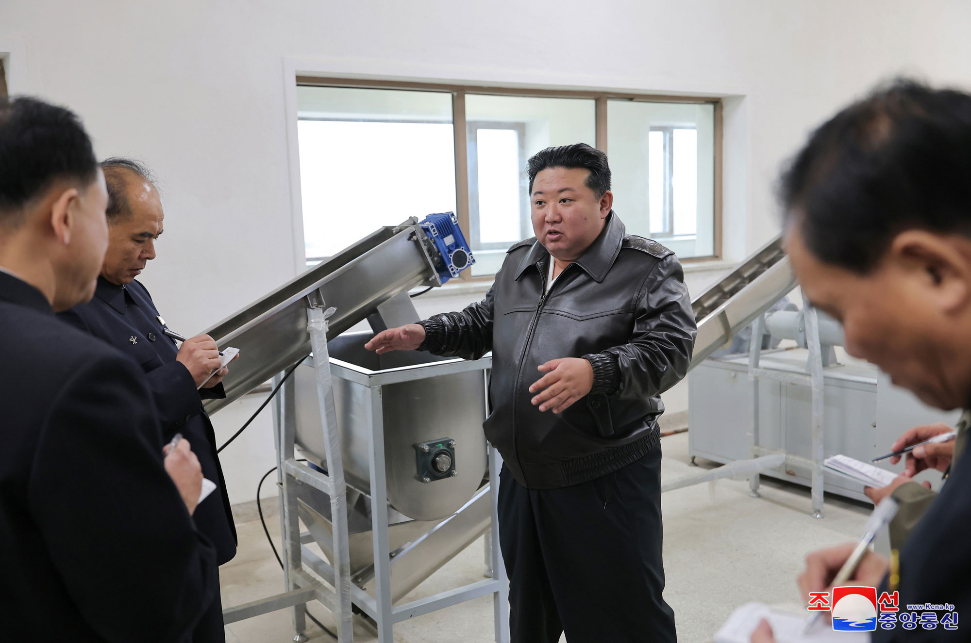 President of State Affairs Kim Jong Un gives field guidance at regional-industry factories under construction in Jaeryong County