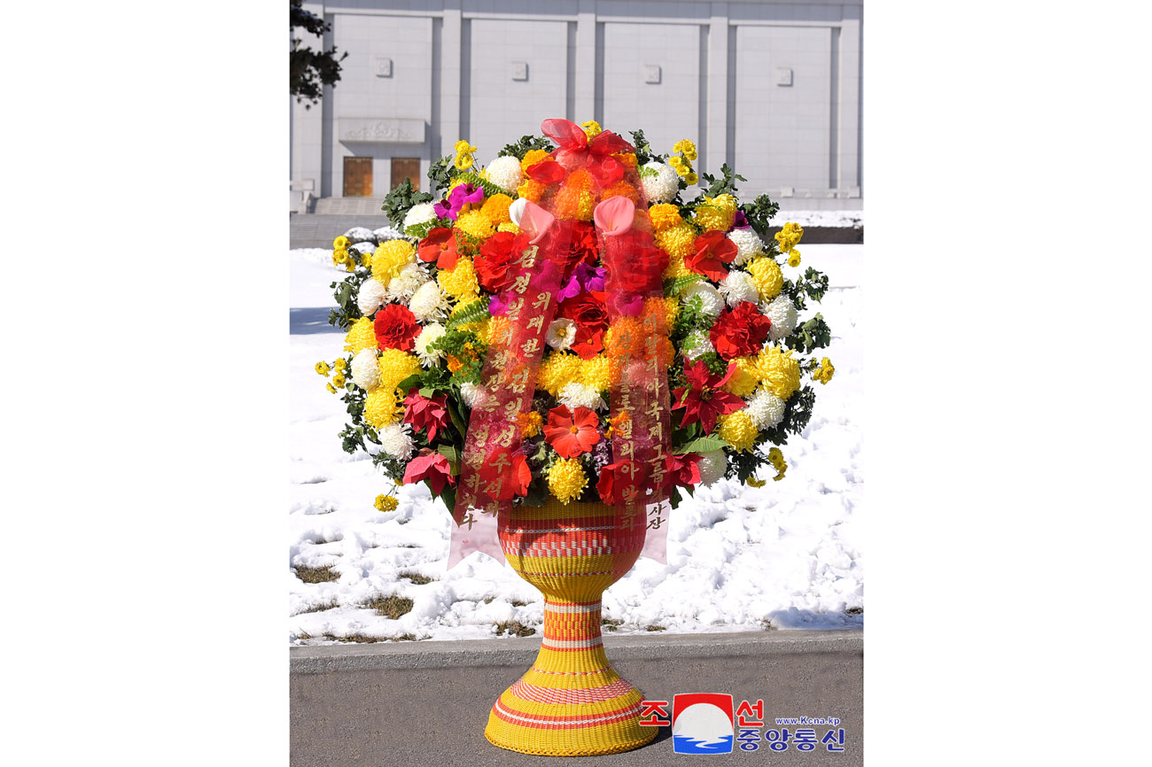 Floral baskets to bronze statues of great leaders Kim Il Sung and Kim Jong Il from abroad