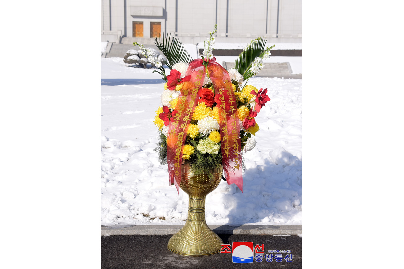 Floral baskets to bronze statues of great leaders Kim Il Sung and Kim Jong Il from abroad