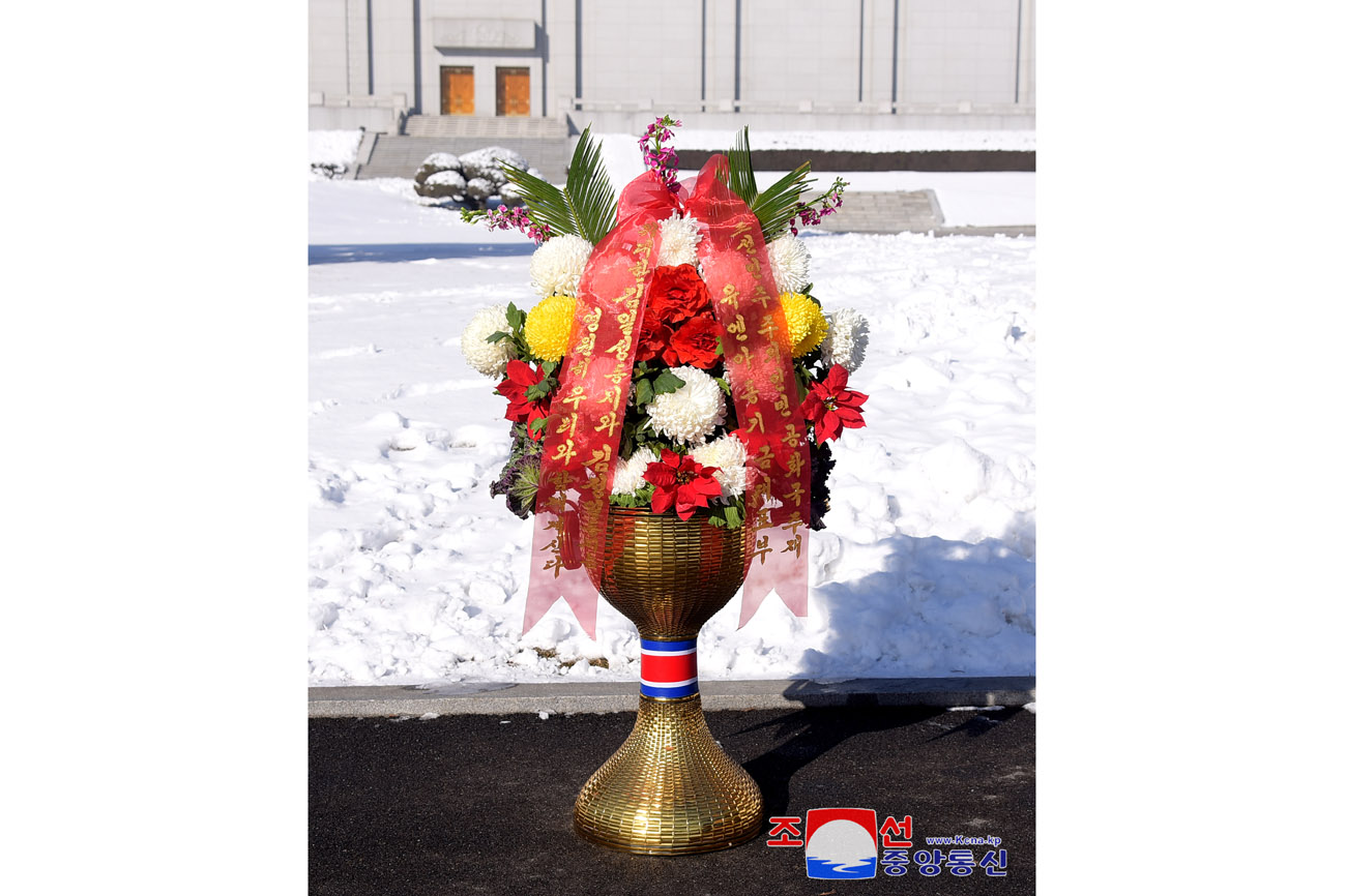 Floral baskets to bronze statues of great leaders Kim Il Sung and Kim Jong Il from abroad