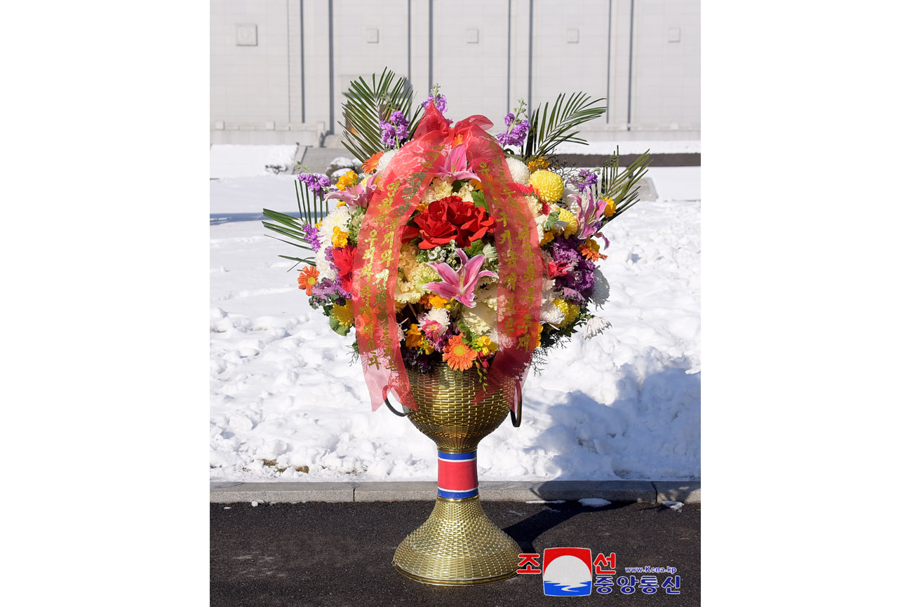 Floral baskets to bronze statues of great leaders Kim Il Sung and Kim Jong Il from abroad