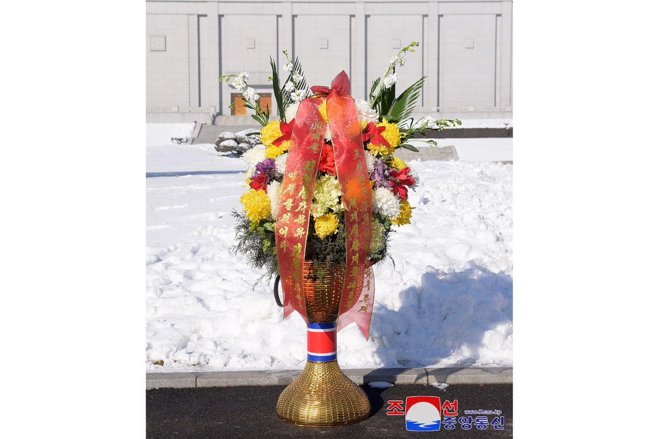 Floral baskets to bronze statues of great leaders Kim Il Sung and Kim Jong Il from abroad