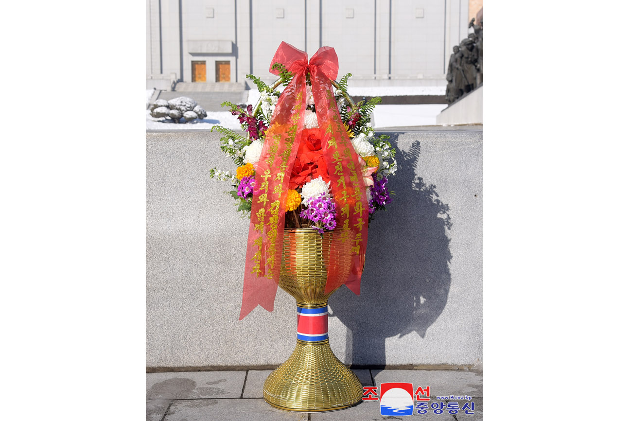 Floral baskets to bronze statues of great leaders Kim Il Sung and Kim Jong Il from abroad